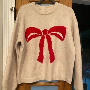 A New Dat Cream Sweater with Red Bow